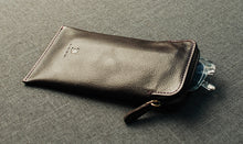 Load image into Gallery viewer, A Franklin-Christoph Glasses / Pen Case in brown napa leather, designed with a zip pouch and a pen insert partially visible inside.