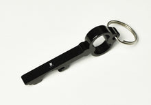Load image into Gallery viewer, Franklin-Christoph Key Ring and Bottle Opener: black aluminum, key-shaped tool with bottle opener, shown on white.