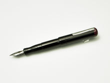 Load image into Gallery viewer, Franklin-Christoph Model 02 Intrinsic Fountain Pen in Black &amp; Cinnamaroon with a silver nib is on a white surface.