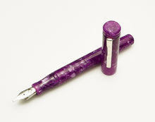 Load image into Gallery viewer, Franklin-Christoph Model 20 Marietta Pearlple fountain pen with silver trim, shown crossed on a white background.