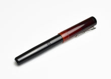Load image into Gallery viewer, Franklin-Christoph Model 31 Omnis Copper Rising fountain pen with silver clip and #6 nib on white background.