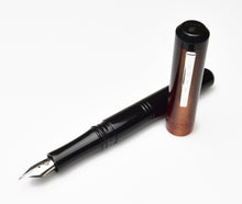 Load image into Gallery viewer, A Franklin-Christoph Model 31 Omnis Copper Rising fountain pen with #6 nib rests on a white background.
