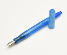 Load image into Gallery viewer, A Franklin-Christoph Model 65 Stabilis Fountain Pen in Maya Blue, uncapped, rests on a clean white background.