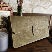 Load image into Gallery viewer, Franklin-Christoph New Penvelope 12 NWF in olive, with removable inserts, on a dark wood desk with vintage decor.