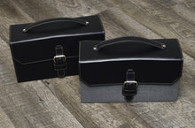 Load image into Gallery viewer, Two leather handbags with handles, buckles, and a Franklin-Christoph Christoph 48 Pen Case are on the wooden floor.