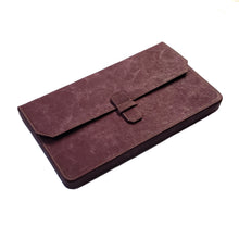 Load image into Gallery viewer, Brown laptop sleeve with flap closure, paired with Franklin-Christoph New Penvelope 12 NWF pen case with inserts.