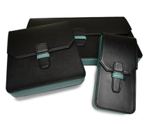 Load image into Gallery viewer, Three Franklin-Christoph New Penvelope 12 Black Teal Leather cases elegantly displayed on a white background.