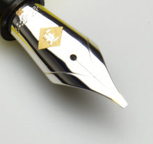 Load image into Gallery viewer, Close-up of shiny 14K BB S.I.G. #6 nib with gold emblem, featured on elegant Franklin-Christoph pens.