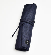 Load image into Gallery viewer, The Seven Pen Roll by Franklin-Christoph is blue denim, string-tied, with a logo label—perfect for organizing pens.
