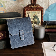 Load image into Gallery viewer, Blue leather satchel with books, candle, glasses, and Franklin-Christoph New Penvelope 6 NWF for stylish pen storage.