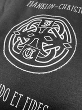 Load image into Gallery viewer, Black and white Celtic knot logo on Franklin-Christoph Pullover Hoodie with detailed circular emblem and brand name.