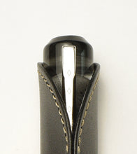 Load image into Gallery viewer, Franklin-Christoph Single Pen Sleeve - Napa Black with a silver-clip fountain pen, top-down on white background.
