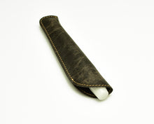 Load image into Gallery viewer, Franklin-Christoph Single Pen Sleeve - NWF Brown, leather with visible stitching, partially covers a white object.