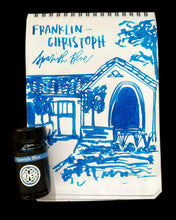 Load image into Gallery viewer, A building sketch in blue ink on a notepad, with a Franklin-Christoph Bottled Ink labeled Spanish Blue beside it.