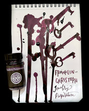 Load image into Gallery viewer, Franklin-Christoph Bottled Ink sits beside a notepad adorned with hand-drawn keys and handwritten notes.