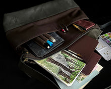 Load image into Gallery viewer, An open brown bag reveals sketchbooks, pens, and Franklin-Christoph Water Color Paper - VN Refill on a dark surface.
