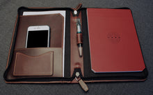 Load image into Gallery viewer, A5 burgundy leather zippered padfolio by Franklin-Christoph with phone, paper, pen, and red notepad displayed.