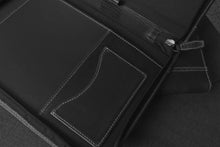 Load image into Gallery viewer, Franklin-Christoph Zippered Padfolio in black leather, shown open on a dark fabric surface.