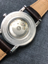 Load image into Gallery viewer, Close-up of the Franklin-Christoph IWO Timepiece’s Swiss movement and brown leather strap—a true heirloom watch.