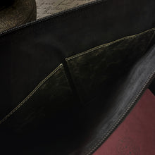 Load image into Gallery viewer, Open Franklin-Christoph Gear Bag with inner pockets, displaying a handwritten letter and maroon item for travel.