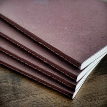 Load image into Gallery viewer, Four Franklin-Christoph Water Color Paper - VN Refills are stacked neatly on a wooden surface.