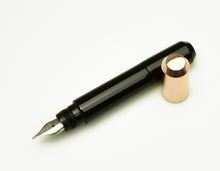 Load image into Gallery viewer, Franklin-Christoph Model 25 pocket Fountain Pen - Copper Black SE with silver nib, on a white background.
