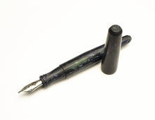 Load image into Gallery viewer, A Franklin-Christoph pocket 66 FP - matte EPW SE, black &amp; silver, uncapped, rests on a white background.