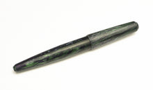 Load image into Gallery viewer, A closed Franklin-Christoph pocket 66 FP - matte EPW SE pen rests on a white surface, featuring green-black marbling.