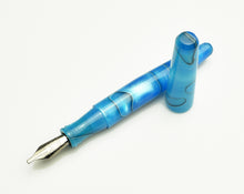 Load image into Gallery viewer, Franklin-Christoph Pocket 66 FP - Sea Blue SE with silver nib and cap lies beside another pen on a white surface.