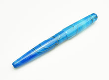 Load image into Gallery viewer, The Franklin-Christoph Pocket 66 FP - Sea Blue SE with wavy silver lines rests on a white surface; fits Pocket 66 cases.