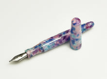 Load image into Gallery viewer, A Franklin-Christoph pocket 66 Fountain Pen - Candystone with block threads lies uncapped on a white surface.
