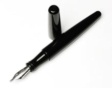 Load image into Gallery viewer, Franklin-Christoph Pocket 66 Fountain Pen - Classic Black, silver nib exposed, rests on a white surface.
